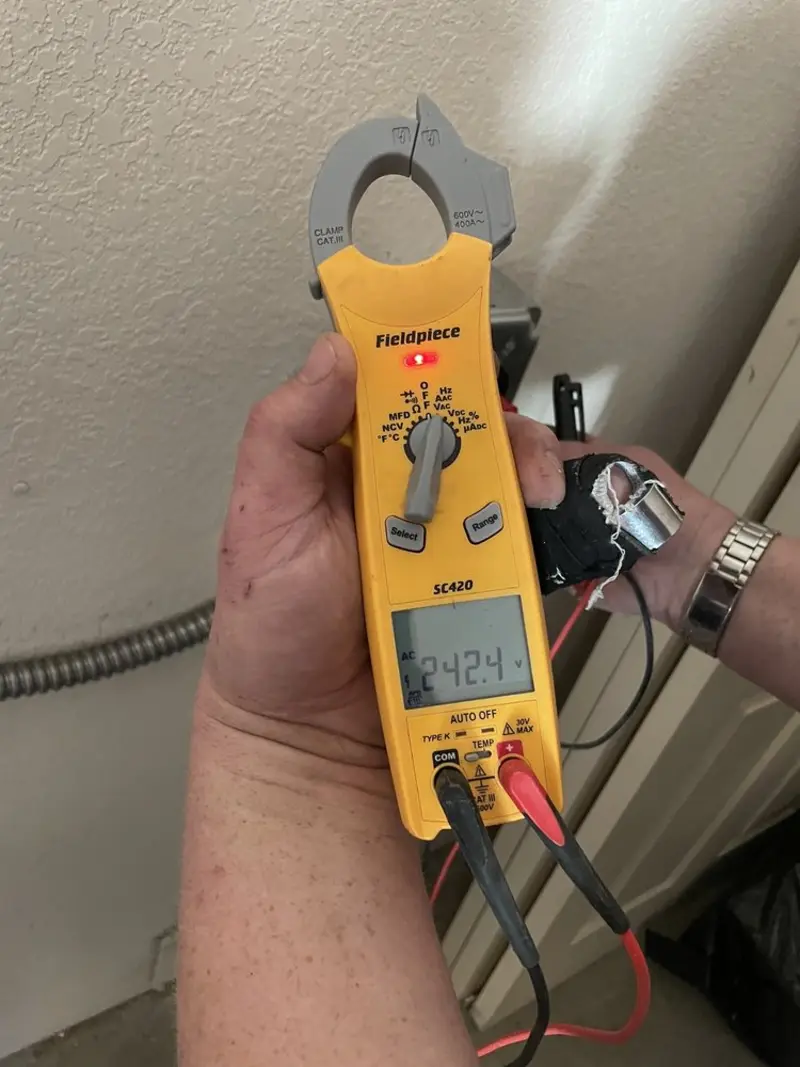 Voltage testing with clamp meter during Ceiling Fan Installation in Monroeville